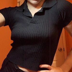 Black ribbed top with collar.